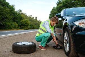 man repairing puncture tyre